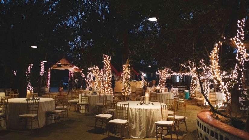 Seating arrangements in an open air setting at The canopy, Capitol Village Resort, Madikeri