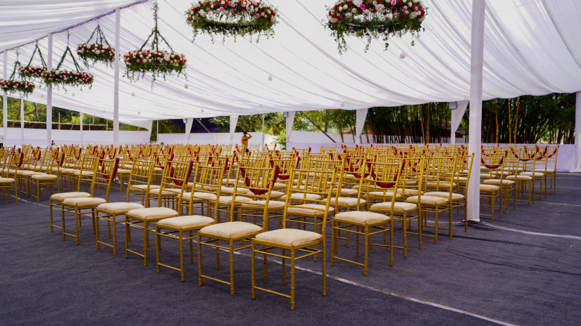 Seating arrangements under a canopy at Aiyanna Lawns, Capitol Village Resort, Madikeri