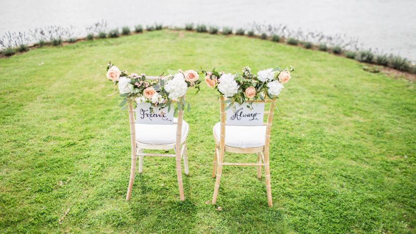 two decorated chairs kept in a lawn