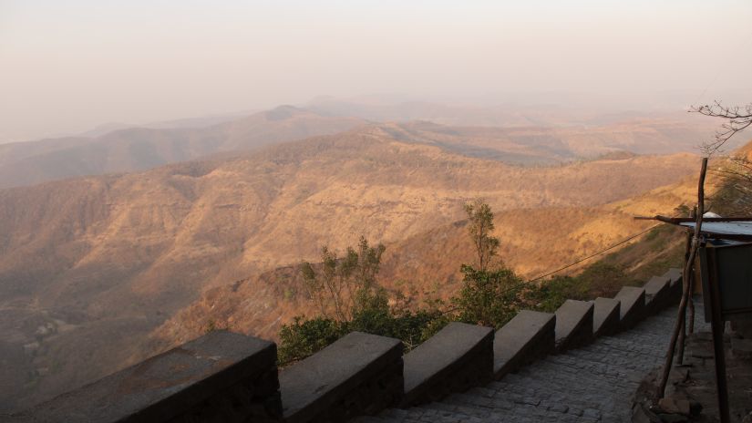 An image of the popular Sinhagad Fort captured from an angle that offers the views of hills -Fort JadhavGADH 