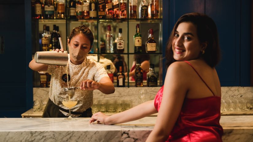 Bartender pouring out a drink at Blue Lagoon in Heritage Village Resort & Spa, Goa