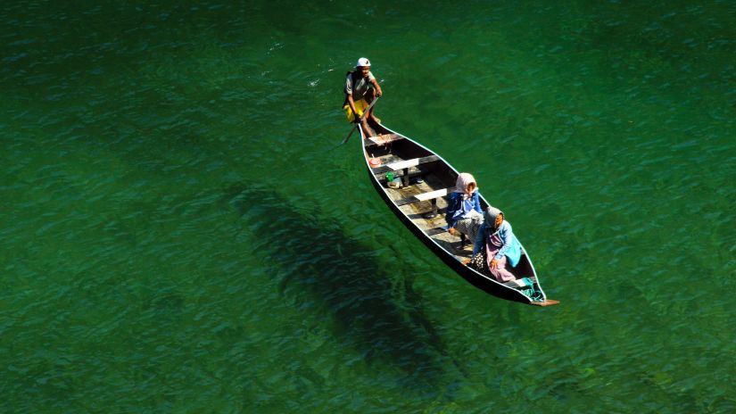 a boat in clear water 93