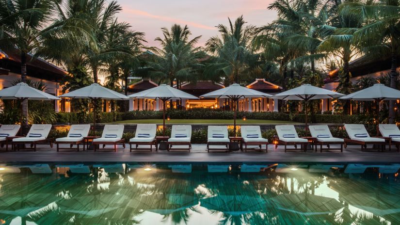 sun loungers beside the pool at Karma Lakelands