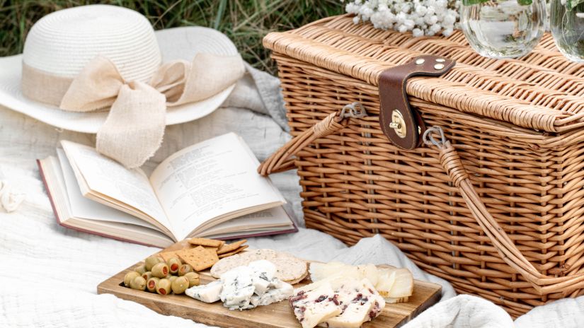 a picnic setup with a basket a hat a book and a basket in view during the day @ Lamrin Norwood Green, Palampur