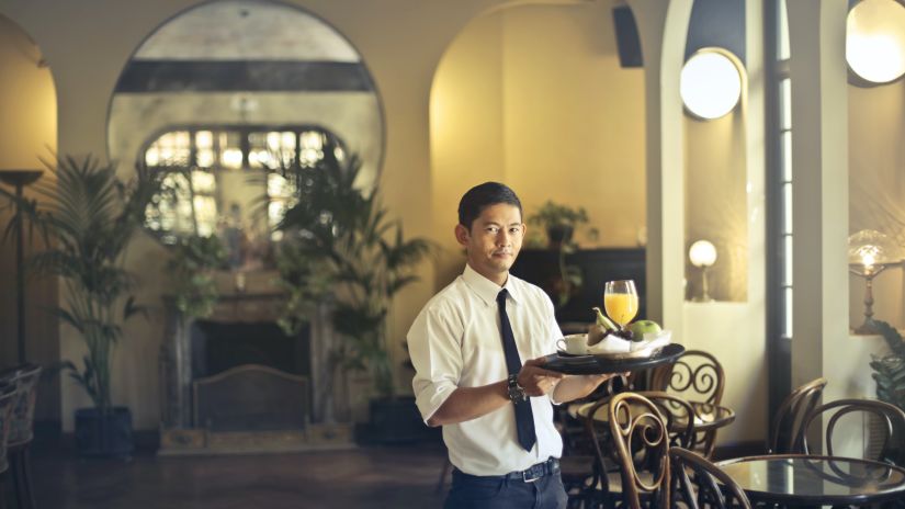 Waiter with a tray @ Lamrin Ucassaim Hotel, Goa