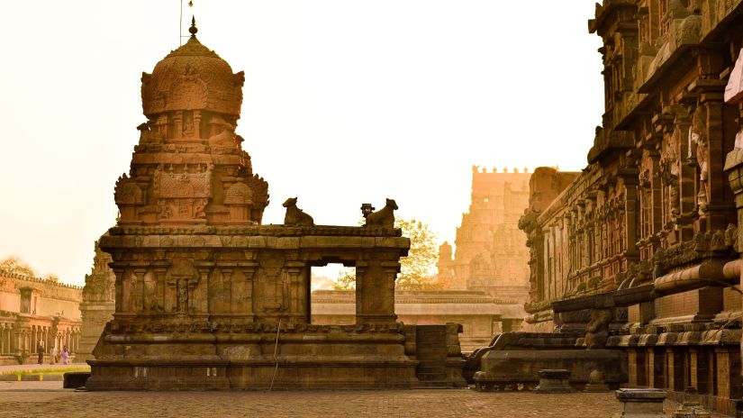 an intricately shaped temple with another building next to it