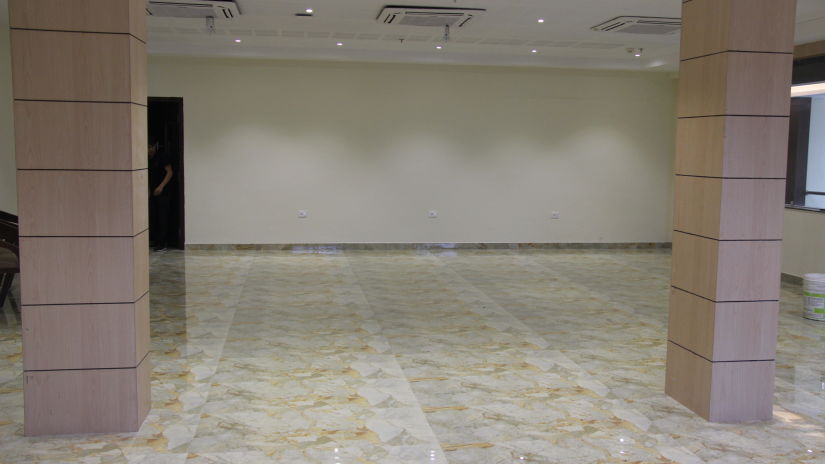 Imperial banquet hall in an open setting arrangement with pillars on either side of the image at Pride Biznotel Canopus Digha