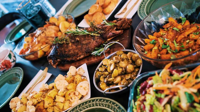 roast meat and side dishes kept in bowls served on a table