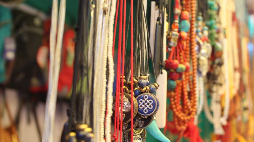 A row of necklaces and other pieces of jewellery made from beads