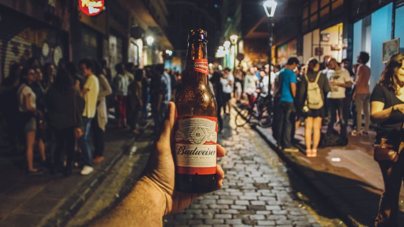 A person holding a beer bottle