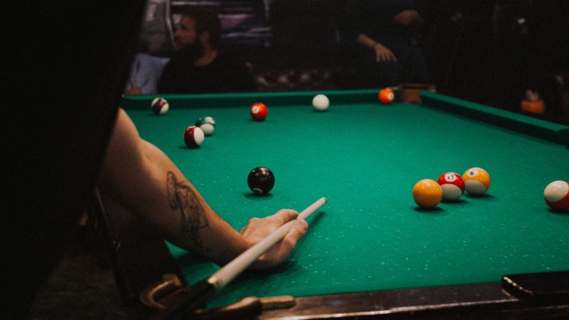 stock image where a person plays billiard