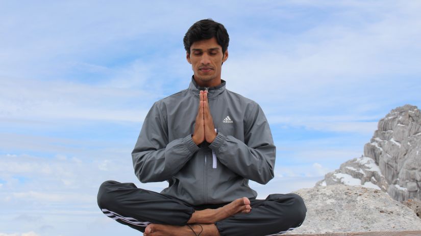 A guy performing Yoga