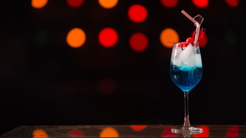 a blue drink on a table