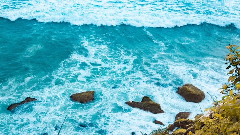 waves crashing on rocks