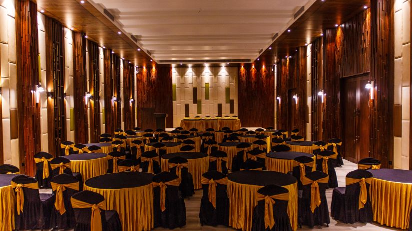 Banquet room set up with a black and yellow theme decor 