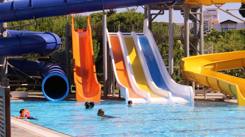 A waterpark with slides leading to the pool