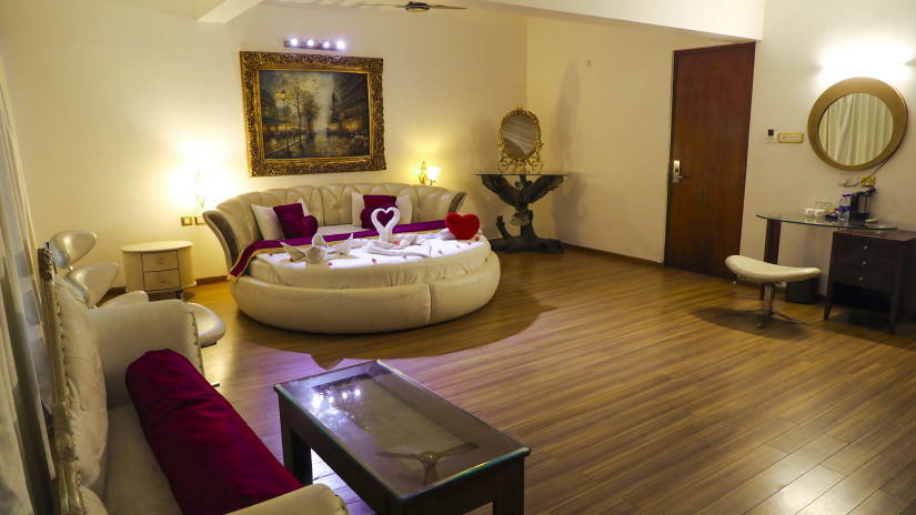 an overview of Honeymoon Suite  with a round bed - White pearl suites by rosetum 