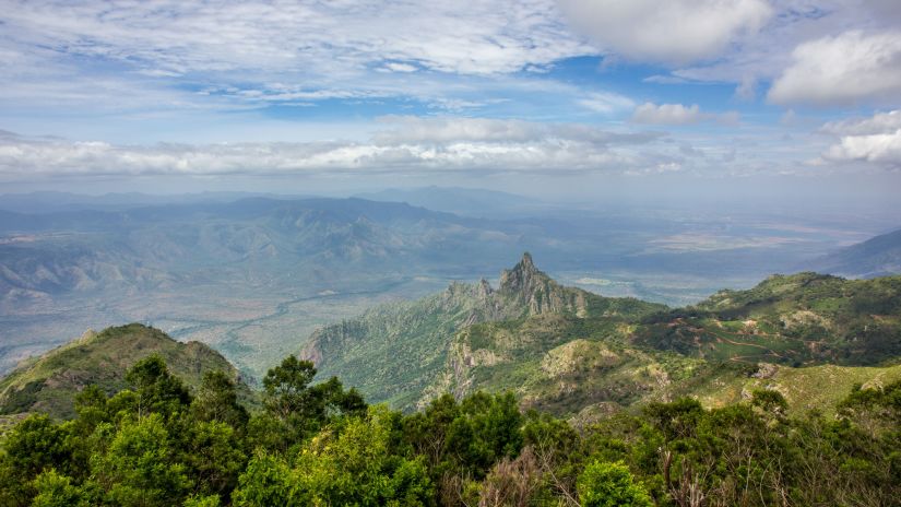 a sunset view point with hills surrounding