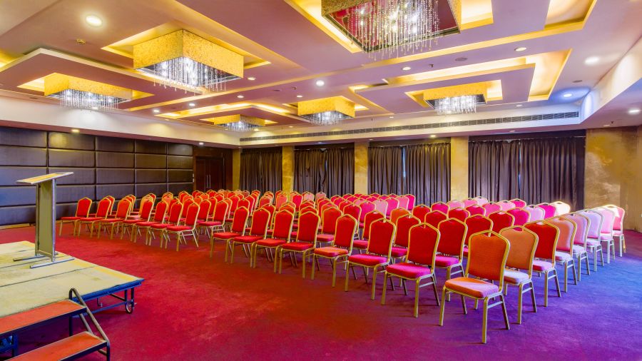 Banquet Hall at GIS Select furnished with red chairs and modern amenities 2