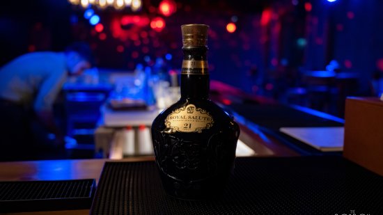 Black bottle of Royal Salute alcoholic drink in The Bourbon Club N Lounge at The Tattva Boutique Resort, Joshimath