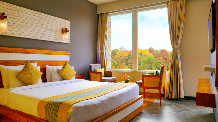 Bedroom with king size bed in Pool View Suite- The Golden tusk