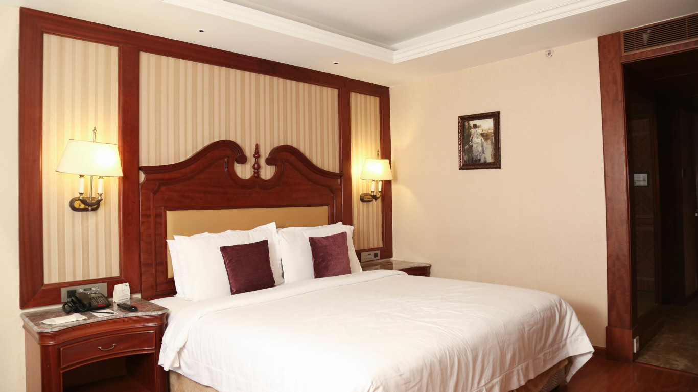 Cosy room with king size bed and modern interiors at Hablis Hotel, Chennai