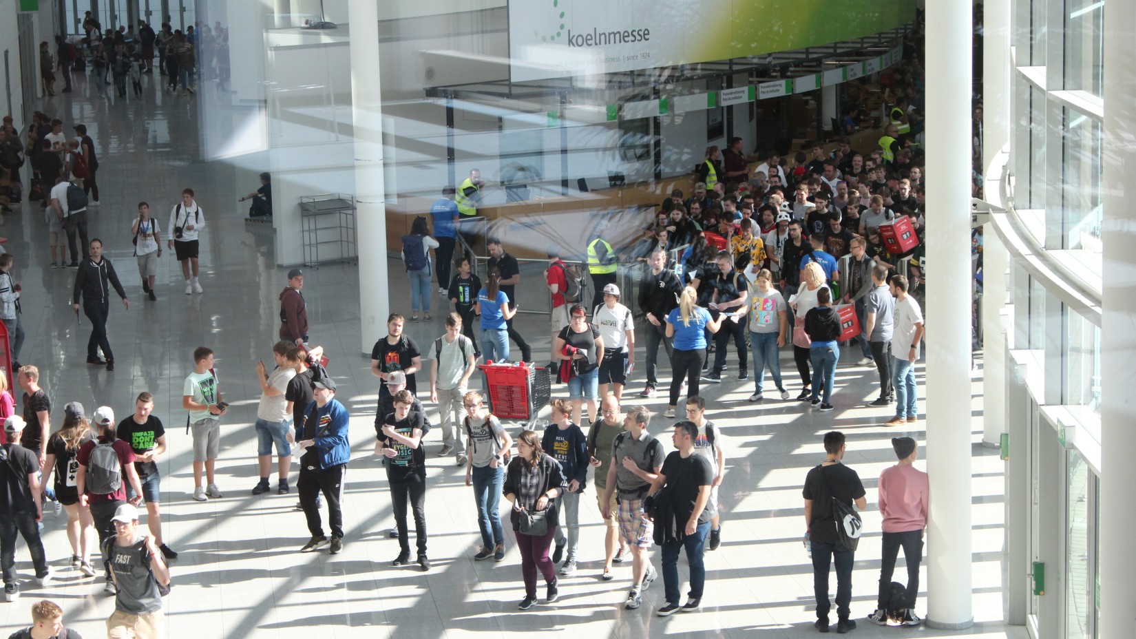 a Crowd walking with the sun shining its rays on them