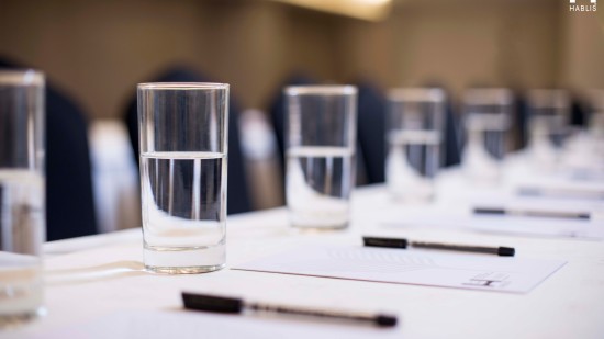 glasses on a table in a meeting room