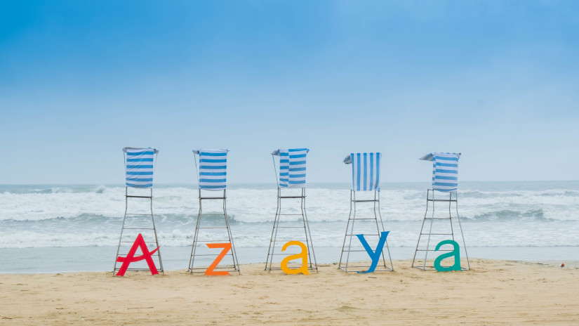 five lifeguard tower chairs on the beach with each chair representing the letters A, Z,  A, Y, A