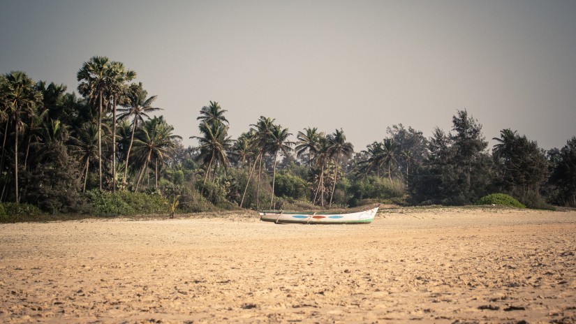 view of a beach with a boat standing on it