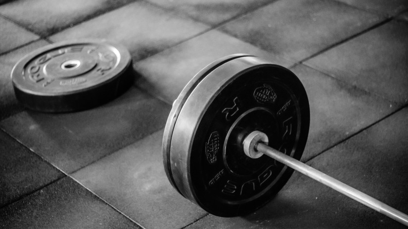 a weightlift laying on the floor at a gym