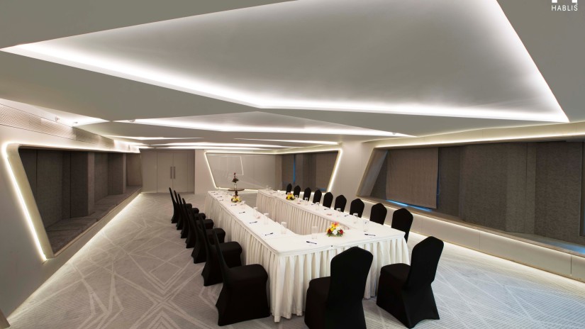 Boardroom seating inside the conference hall at Hablis Hotel, Chennai