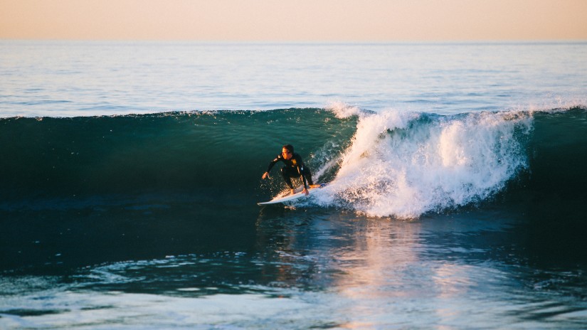 Surfing at Dewata Beach