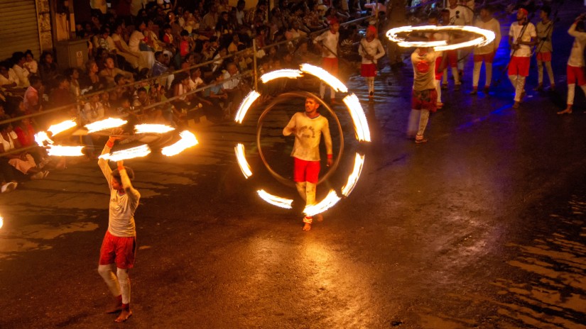 acrobats perfroming during an Esala Perahera procession 