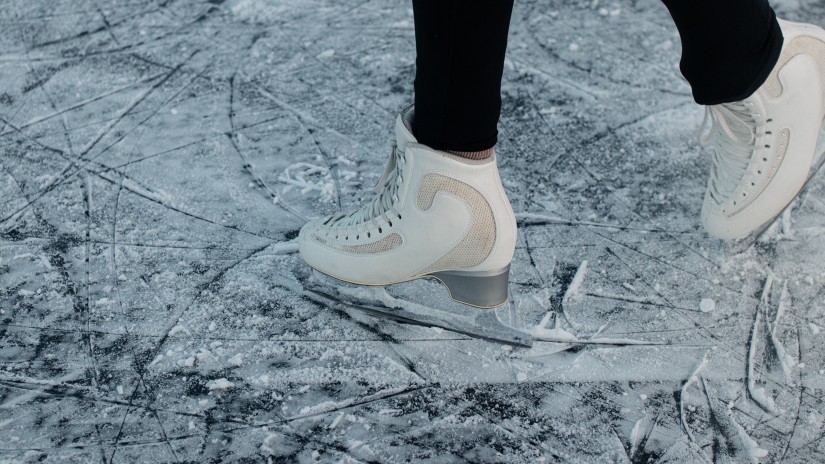 person wearing ice skating shoes 