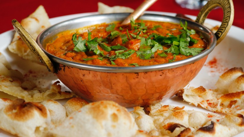 A plate of bread and a gravy served as a traditional dish of Gujarat 