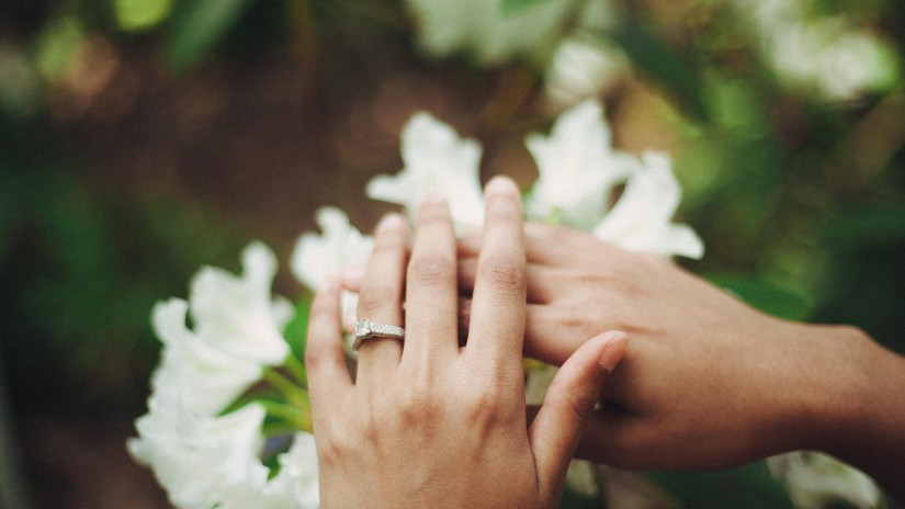 A couple showing their wedding rings