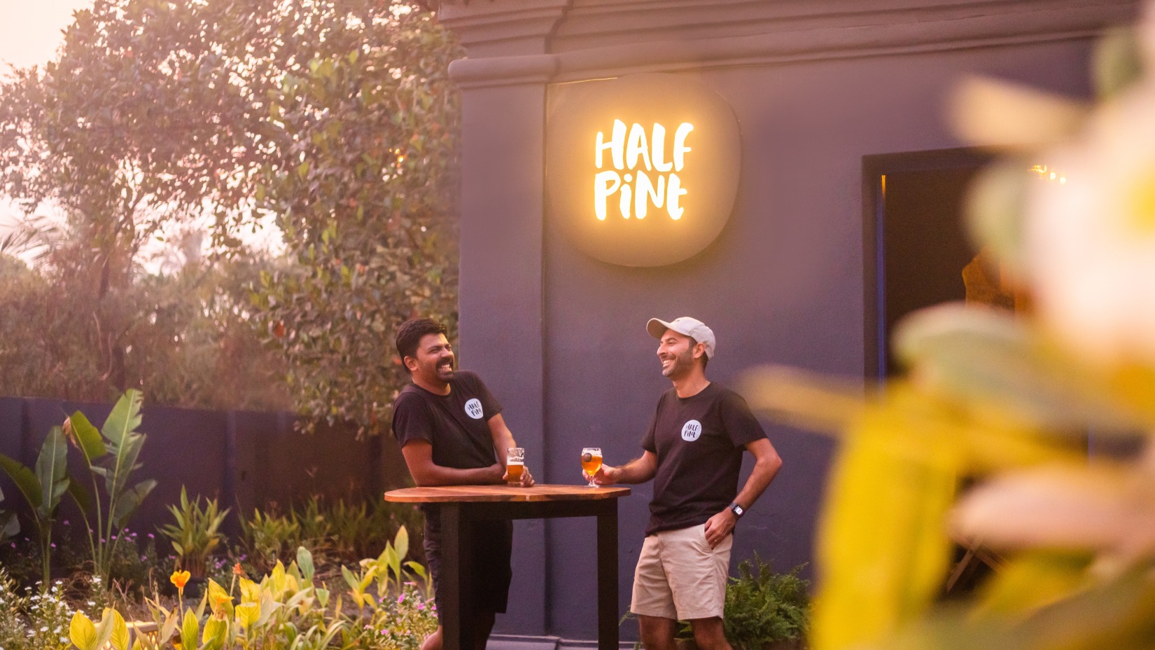 two men standing at Half Pint bar in Goa - Villa in Palms by V Escapes