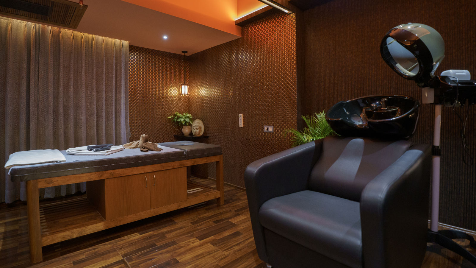 Spacious and elegant spa therapy room with modern amenities and ambient lighting - Coral Reef Hotel, Port Blair