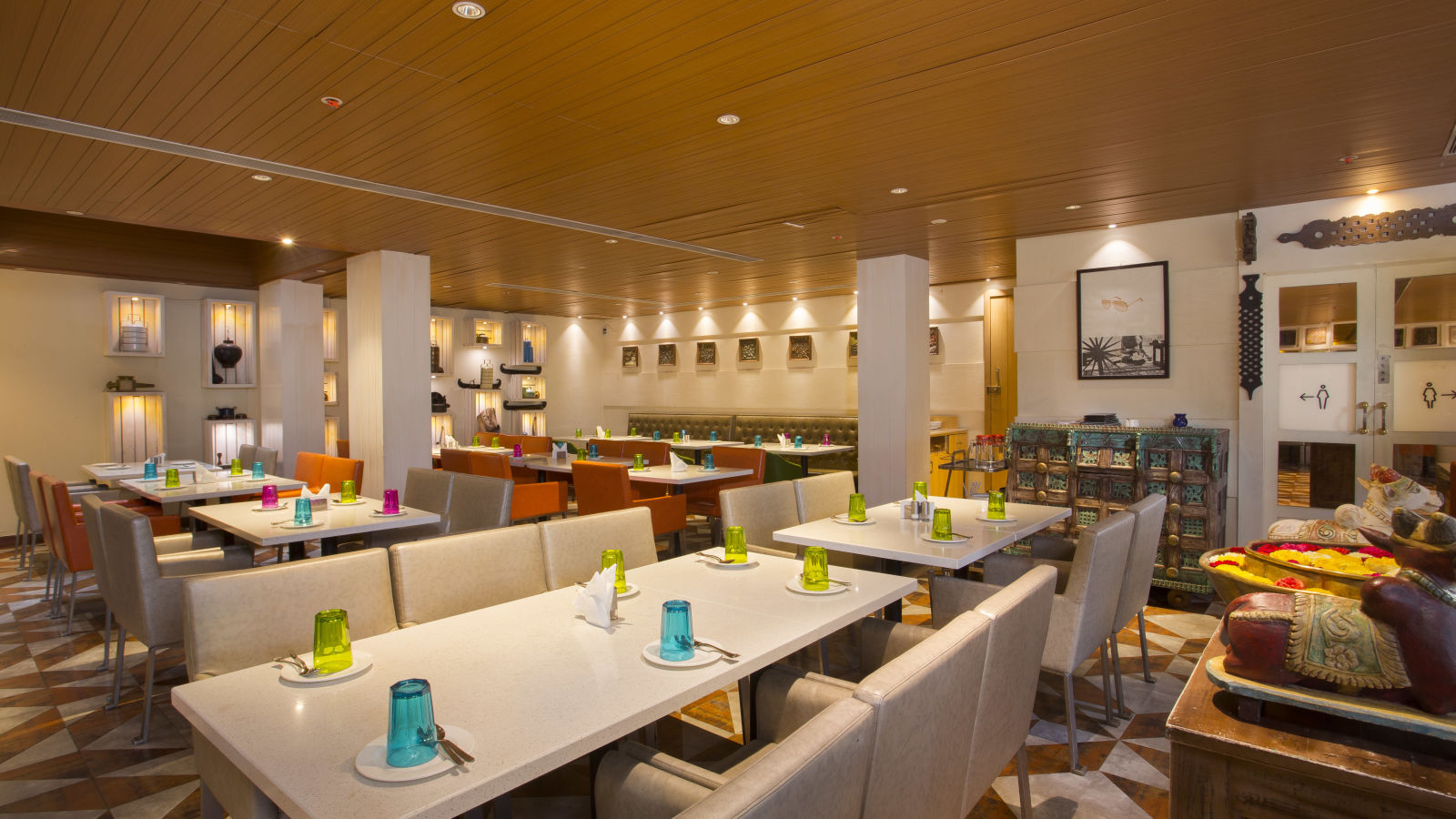 view of a restaurant with rows of rectangular tables with chairs on the long sides - Hotel Fountain Tree By TGI - JP Nagar, Bangalore