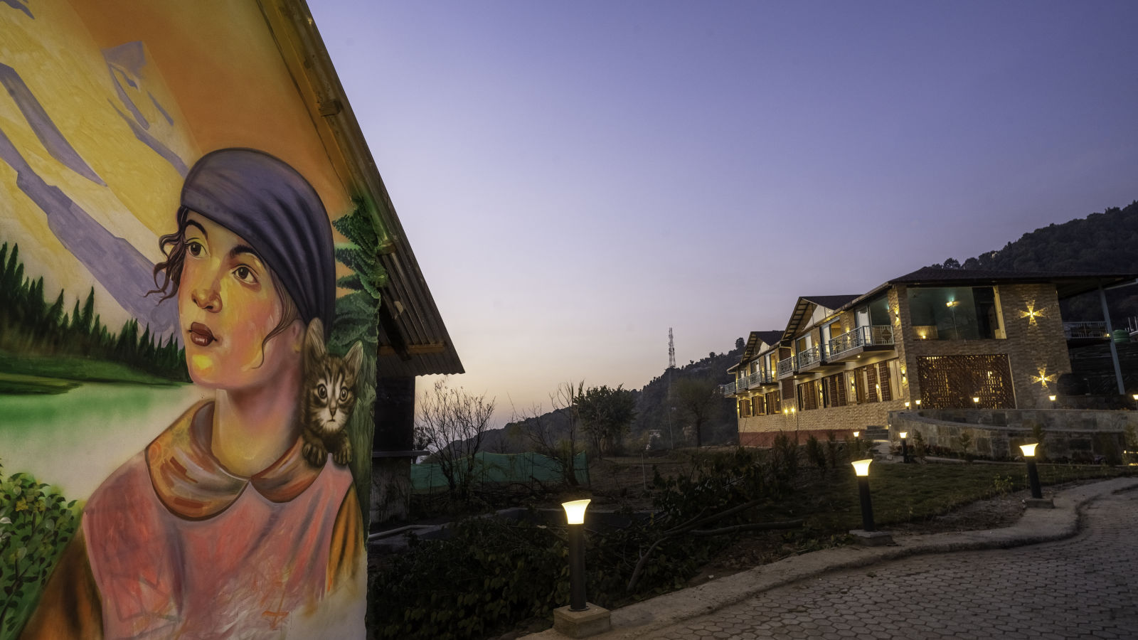 Exterior of Infinitea Retreat Bir with Wall Art