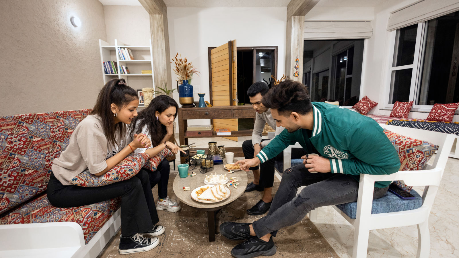 a group of people enjoying their meal in the restaurant at Kothli Hills, Rishikesh