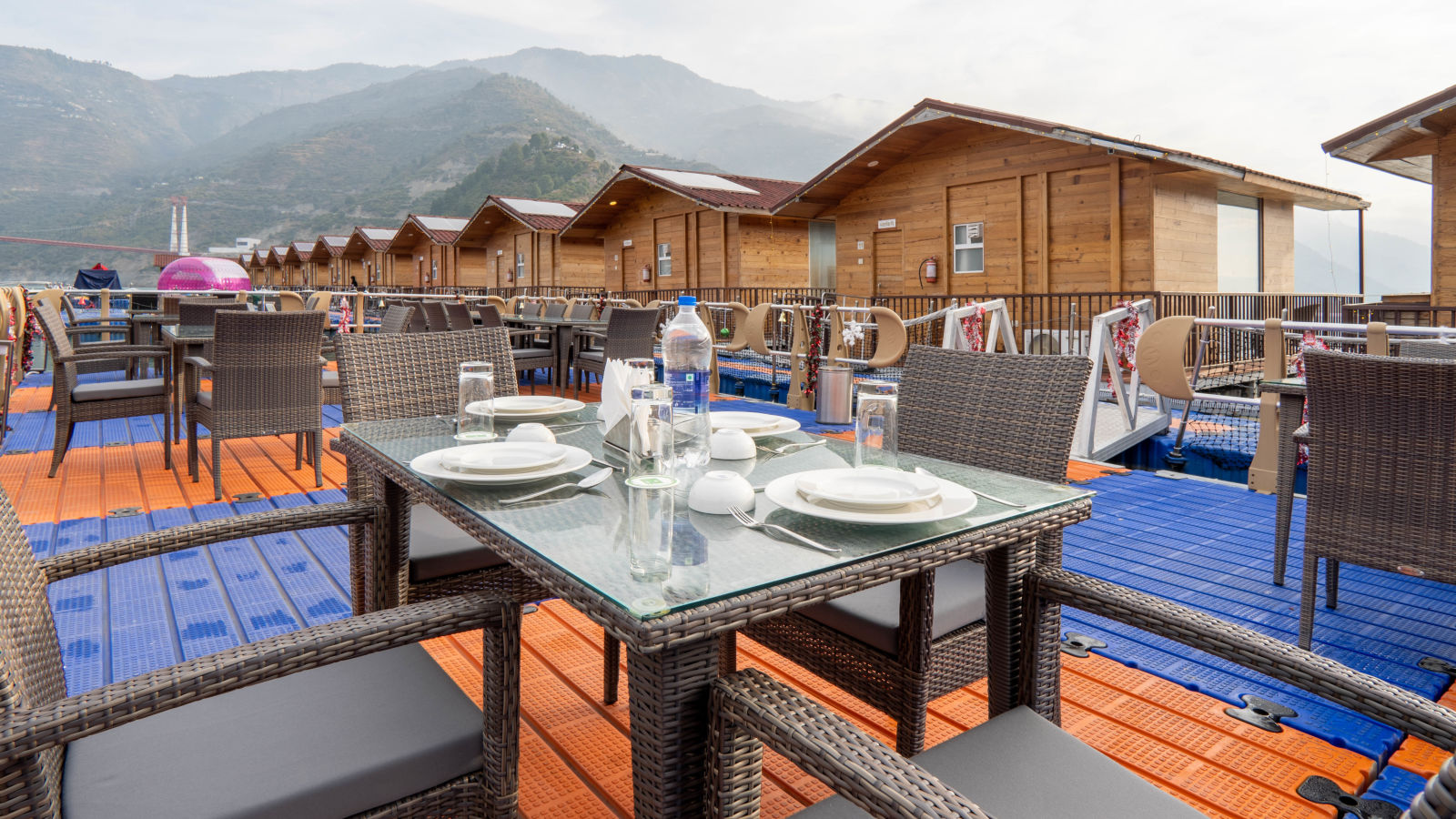 bedroom and dining area view at Floating Huts - Over the Lake captured during the day at Le ROI Floating Huts Eco Rooms5