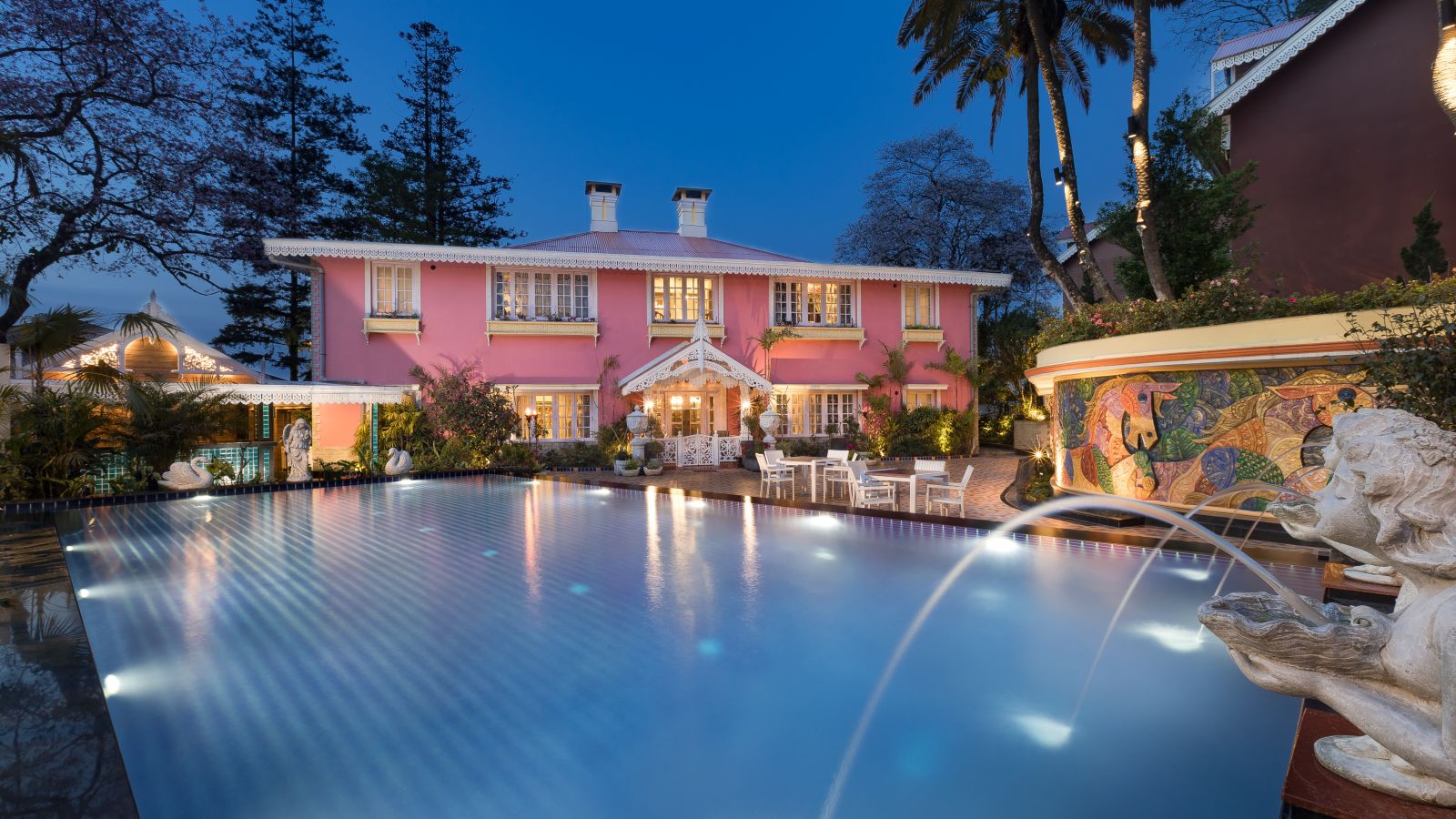 the swimming pool at night time - Mayfair Himalayan Spa Resort Kalimpong