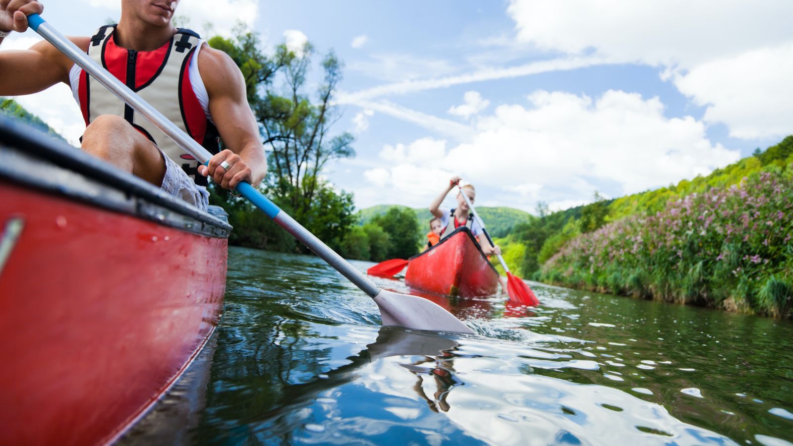 A perspective capturing individuals kayaking in the direction of the viewer - Kumarakom kayaking