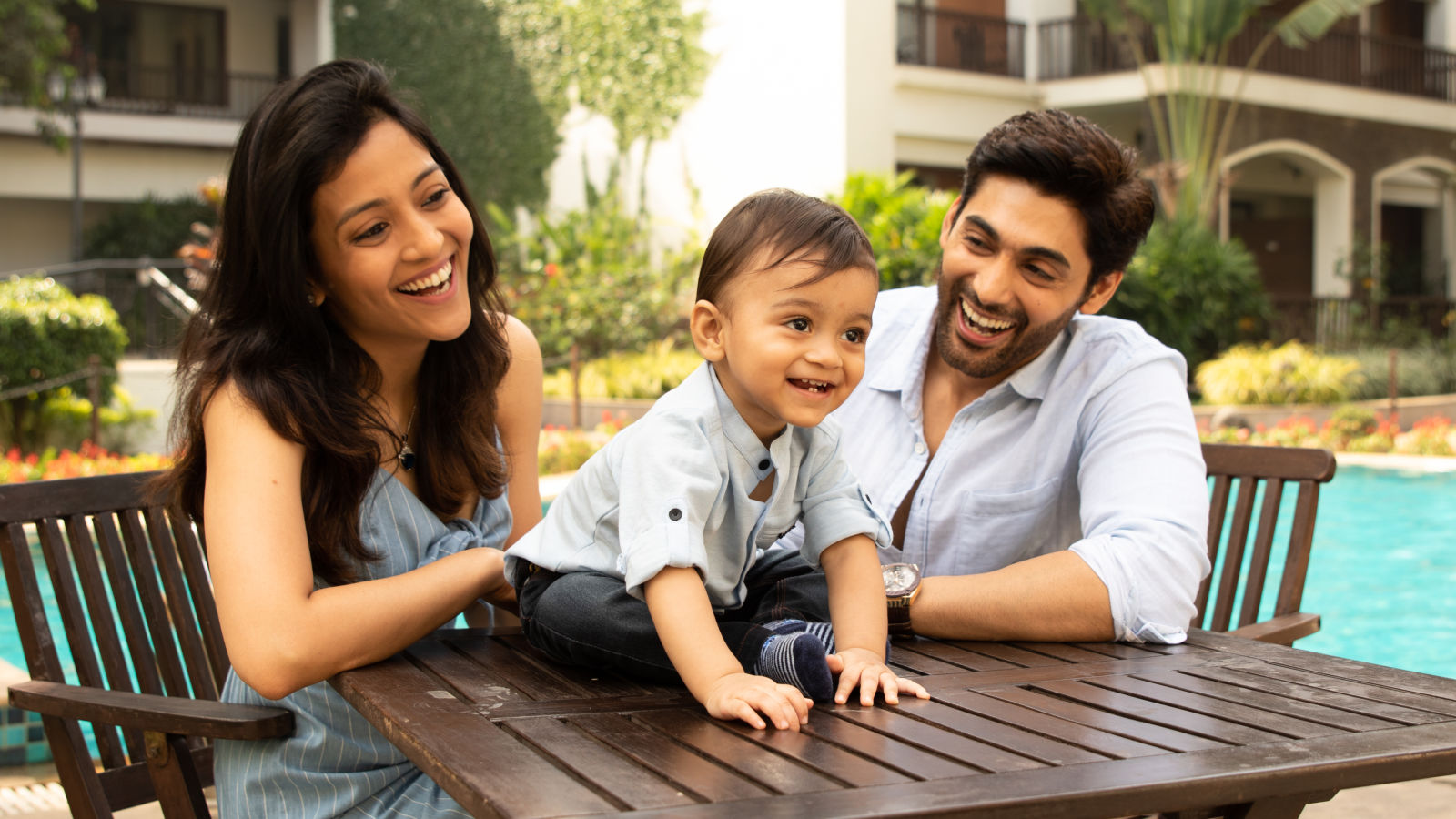 Parents spends time with their baby on the resort