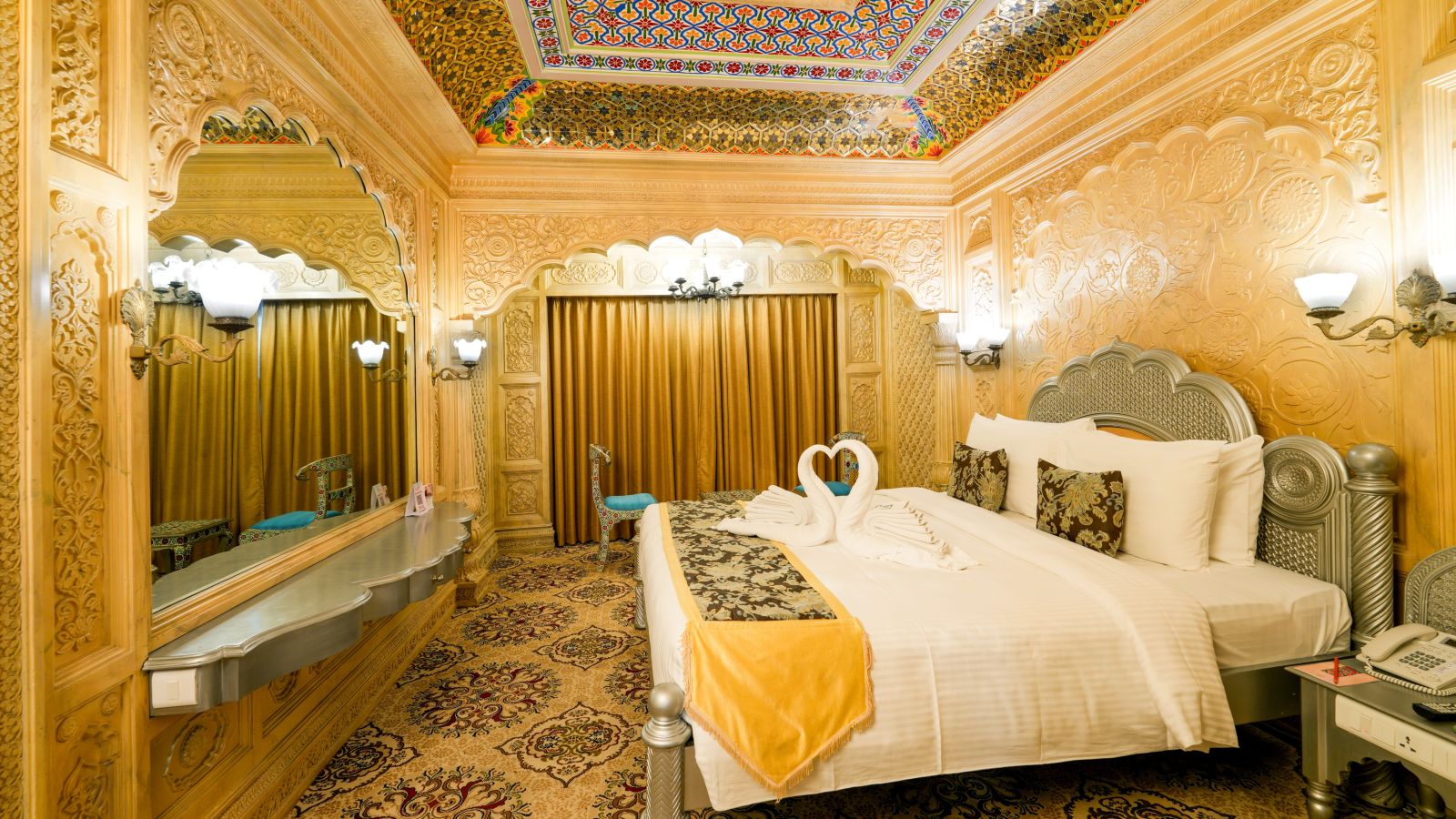 Themed room at Sitara Luxury Hotel with a king size bed and side tables