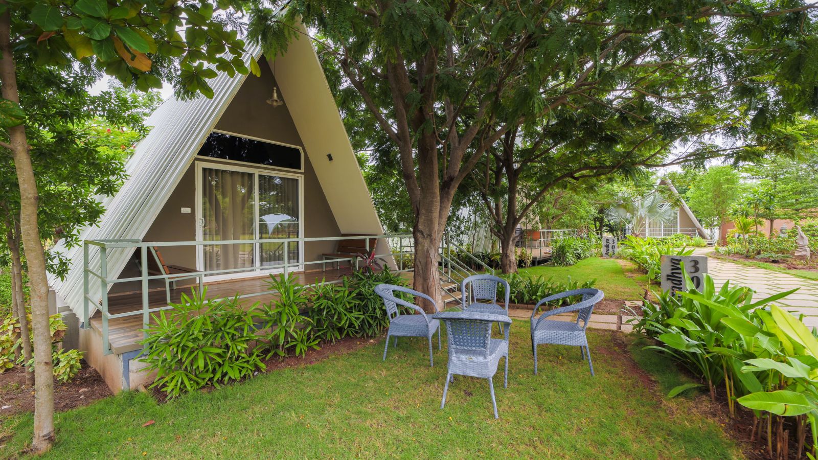 An image of Aradhya Room with outdoor seating in the lawn - Trance Veechika Resort, Vikarabad 