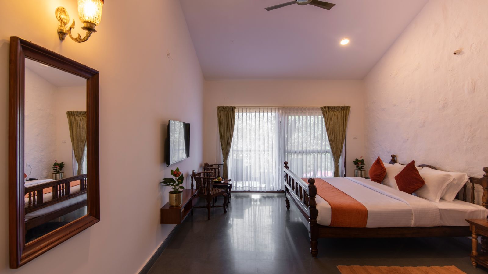 room with bed and large mirror - Tapovana, Sakleshpura