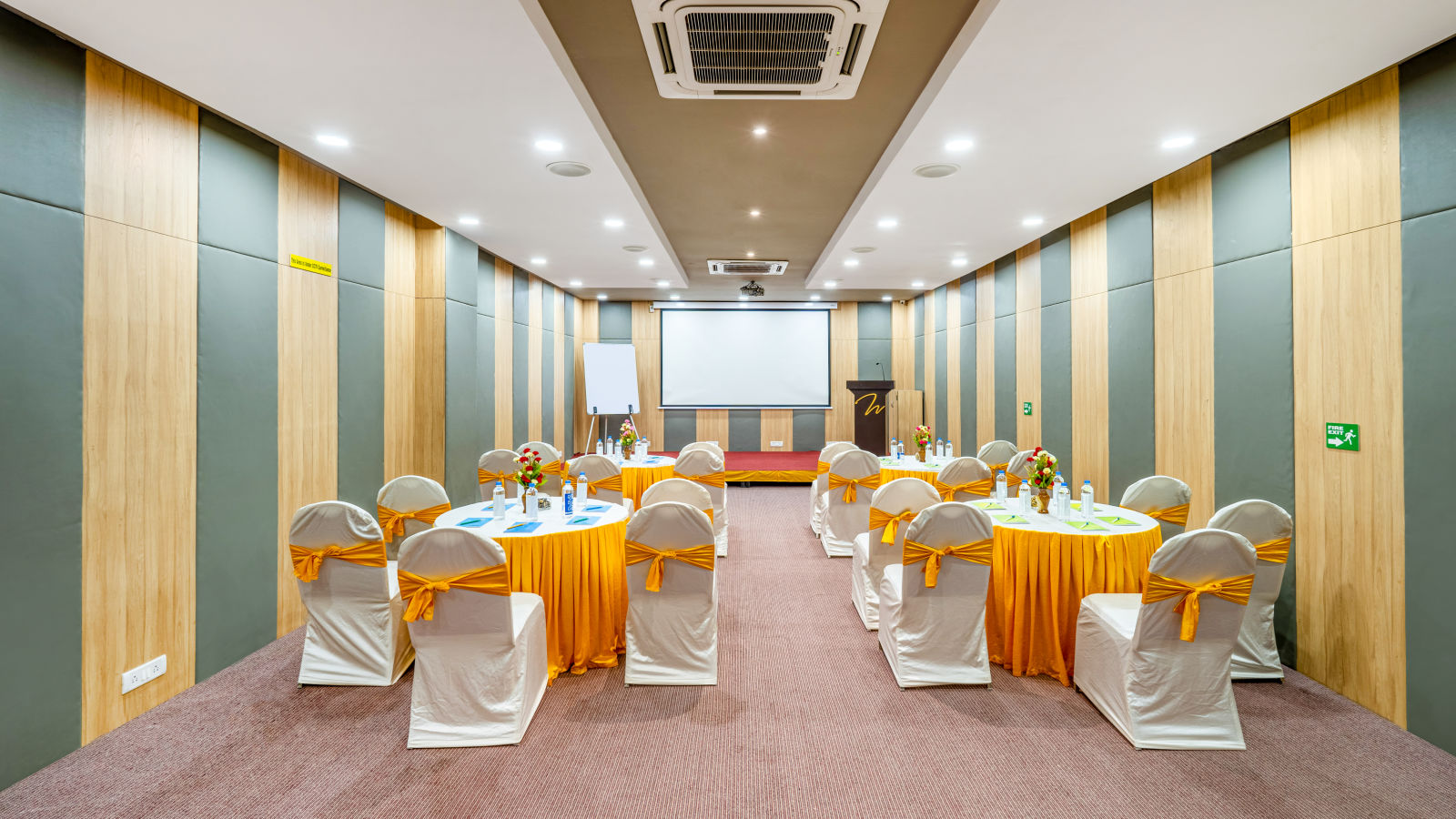 A high-tech conference room with a table and chairs at Westside Hotel